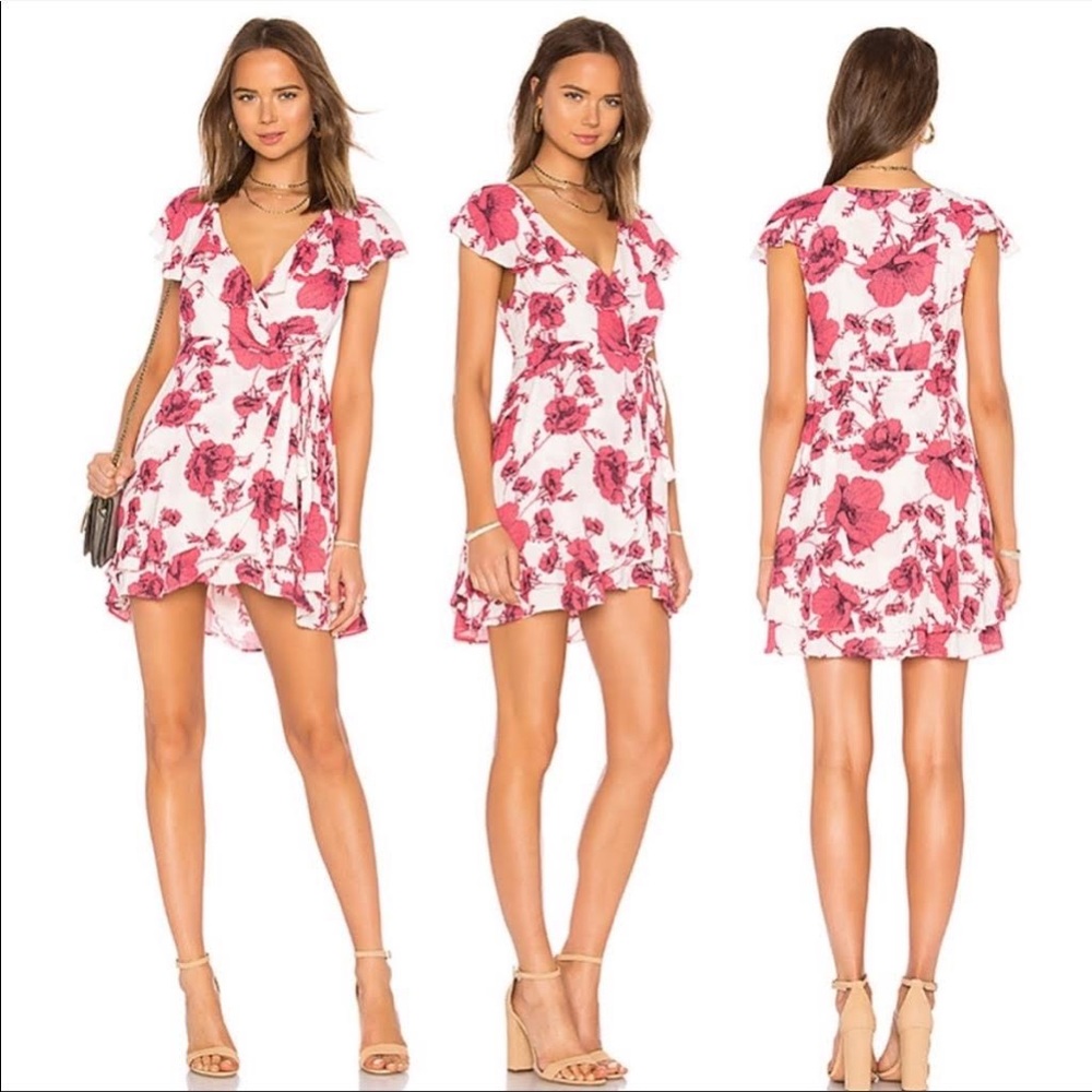 Free people pink floral wrap mini dress. Never worn. NWT